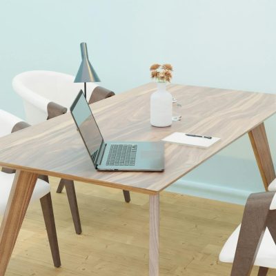 Bright and cozy minimalist home office space with wooden furniture.