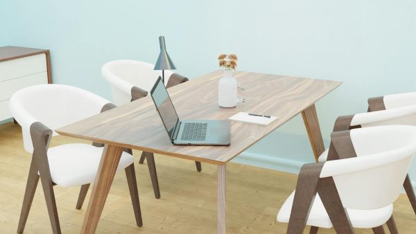 Bright and cozy minimalist home office space with wooden furniture.
