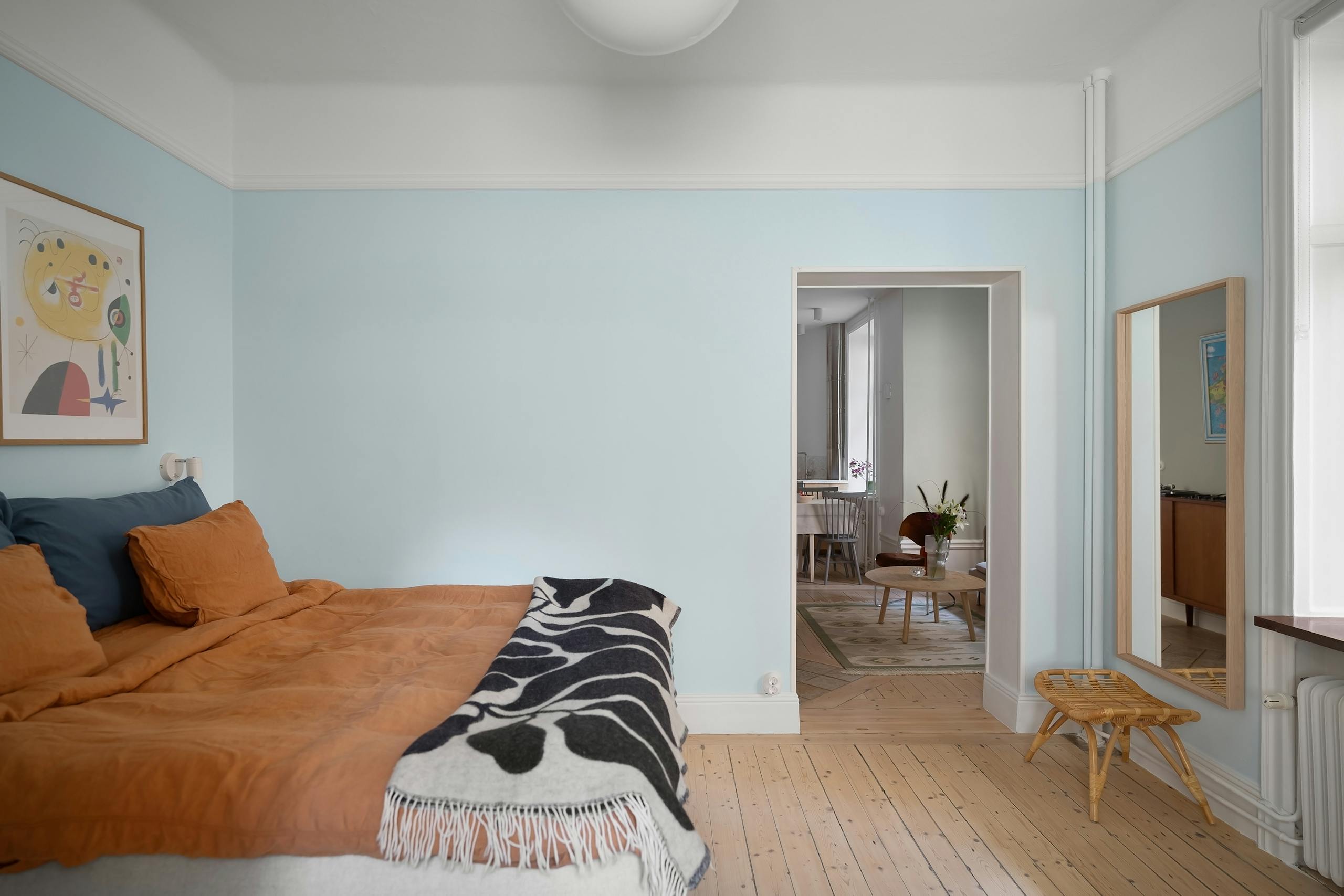 Stylish bedroom showcasing minimalist Scandinavian interior design with warm and cozy decor.